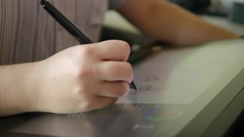 Artist Drawing on a Tablet with Stylus