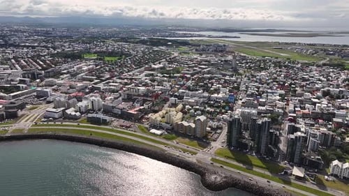 Reykjavik, Iceland. Aerial View of City Downtown and Coastal Buildings and Traffic on Sunny Day, Dro