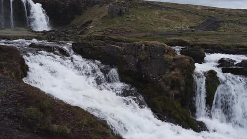 Panning and tilting footage of the amazing waterfall kirkjufellsfoss starting from the top and movin