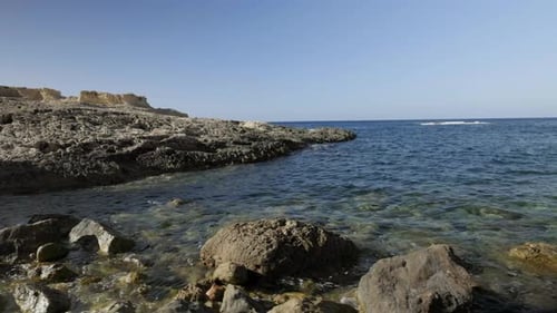 Close up rocks and stones on tropical island beach in summer sun