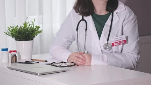 Doctor Consulting with Patient in Office Setting