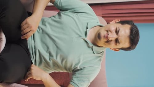 Vertical video of Man with nausea.