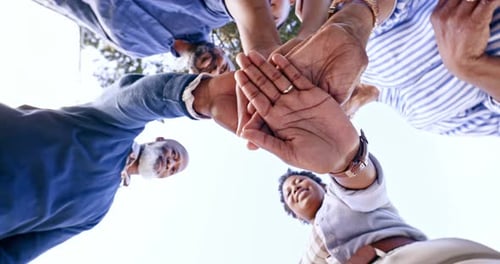 Diverse Group Joins Hands in Circle of Friendship