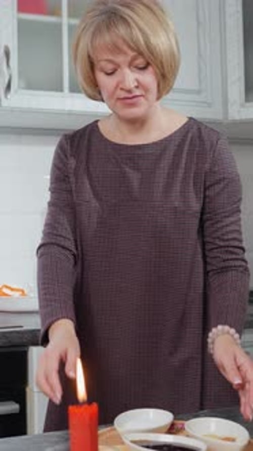 Woman Preparing Food on Counter in Kitchen