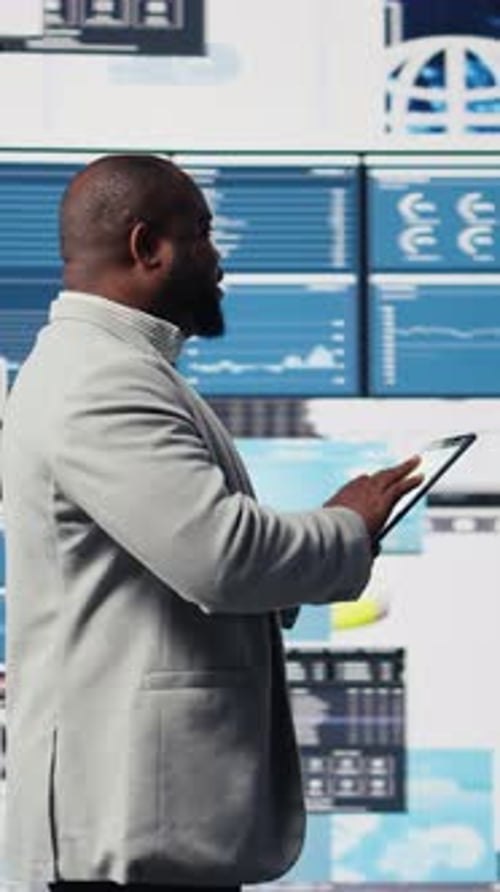 Man Using Tablet in High-Tech Office Environment