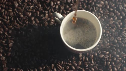 Coffee Being Poured Into a Mug
