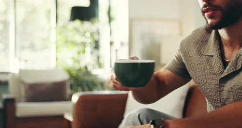 Man Drinks Coffee in Bright Airy Room