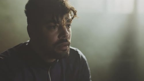 Depressed man sitting in gym