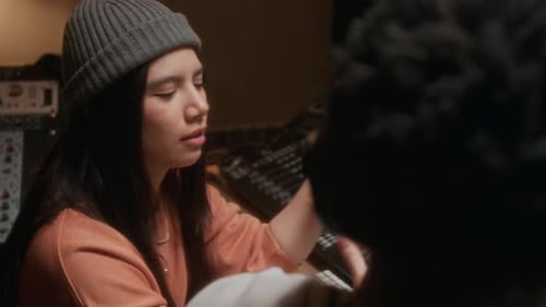 Artist Talking to Sound Engineer in Recording Studio