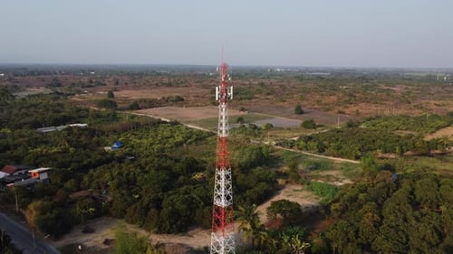 Transmission tower or pylon in aerial view. Telephone pole against rural landscape.