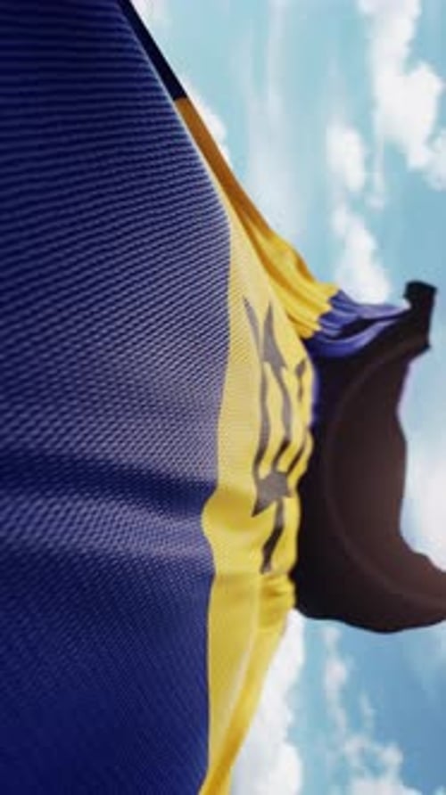 Barbados National Flag Waving with Blue Sky Background