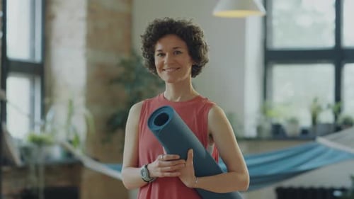 Portrait of Woman with Yoga Mat