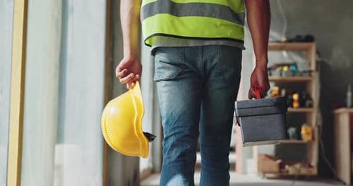 Hands, person and helmet with tool box for construction, building maintenance