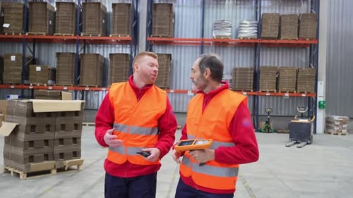 Warehouse Workers Discussing Logistics and Inventory Management