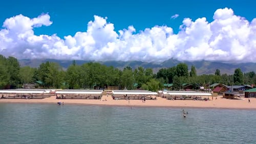 Aerial view of beach resort with pier and apartments