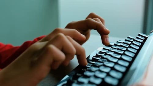 Writing letters with orange retro vintage typewriter
