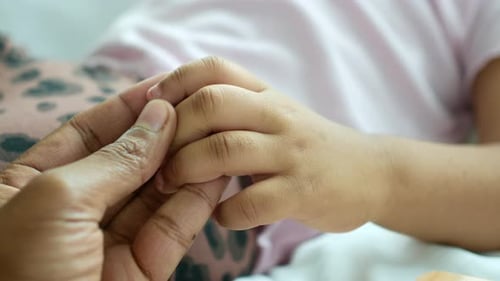 Father Holding Child Hand Close Up