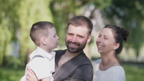 Happy Family Summer Concept Dad Mom and Son Portrait in Park