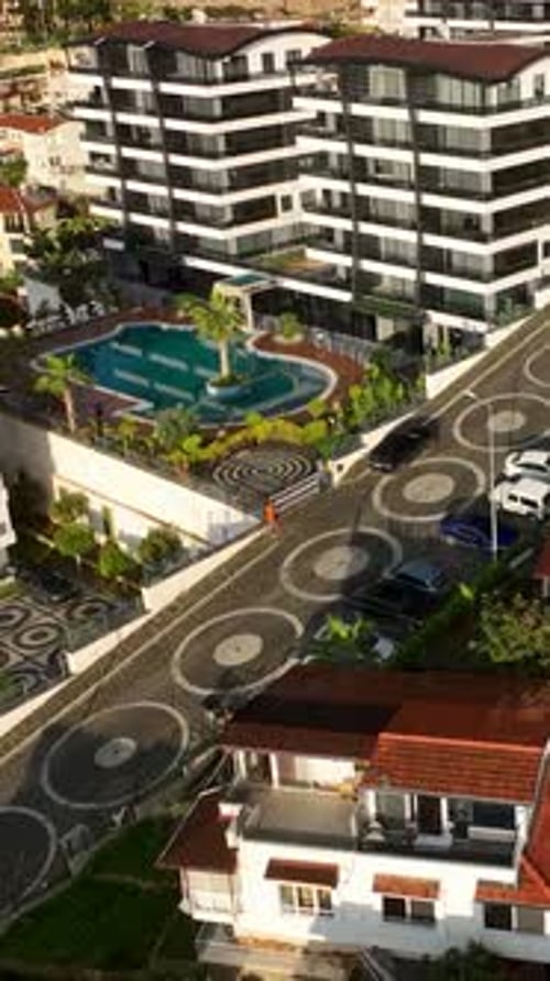 Vertical Video Aerial Elegance Stunning View of Luxurious Homes and Residential Areas in a Small