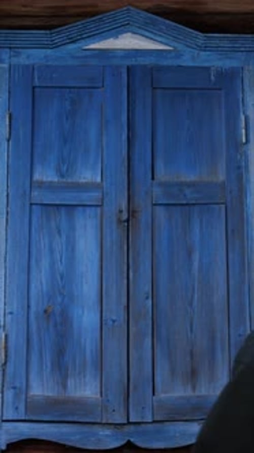 Vertical Concept of Beginning and Start Opening a Window Shutters on Window