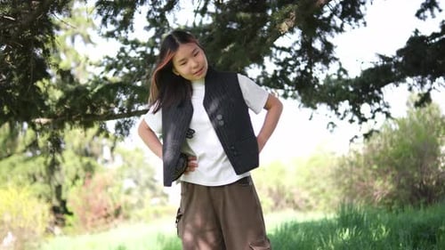 Young Adult Stretching Outdoors on Sunny Day
