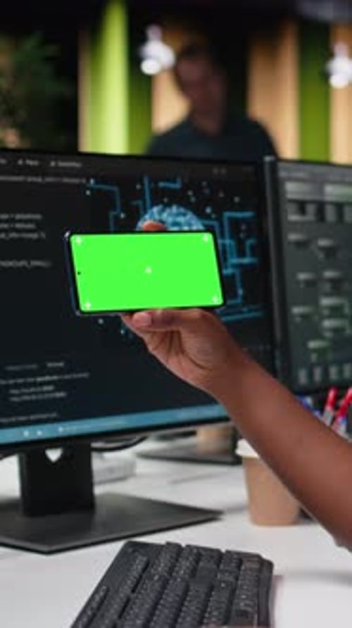 Vertical Video Green Screen Mockup Phone Used By Programmer Typing Code