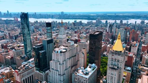Slow descend over the buildings of beautiful modern Manhattan. Vast panorama of New York, USA.