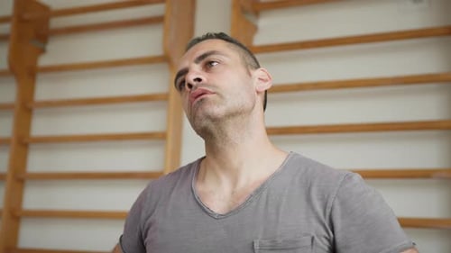 Sportsman Does Neck Stretch Before Training