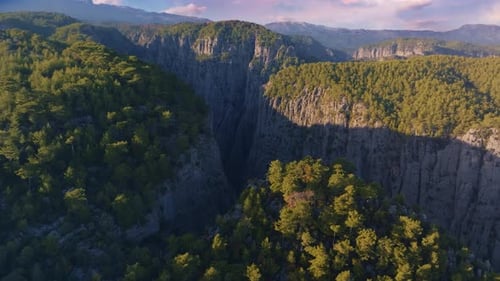Video Footage From a Drone Flying Over a Canyon in a Mountainous Area