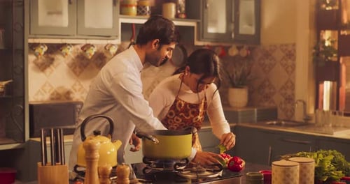 Couple Cooking Together in Bright Kitchen