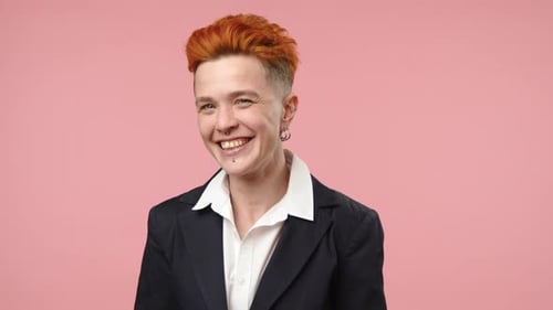 Person Smiling and Winking in Studio Close Up