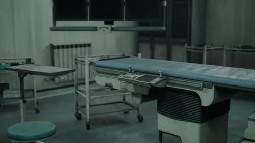 Abandoned Hospital with Decaying Surgery Tools in a Dark Ward