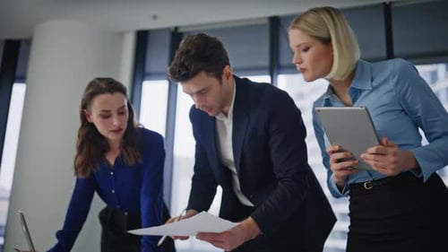 Busy Managers Looking Architectural Plan of New Construction in Office Closeup