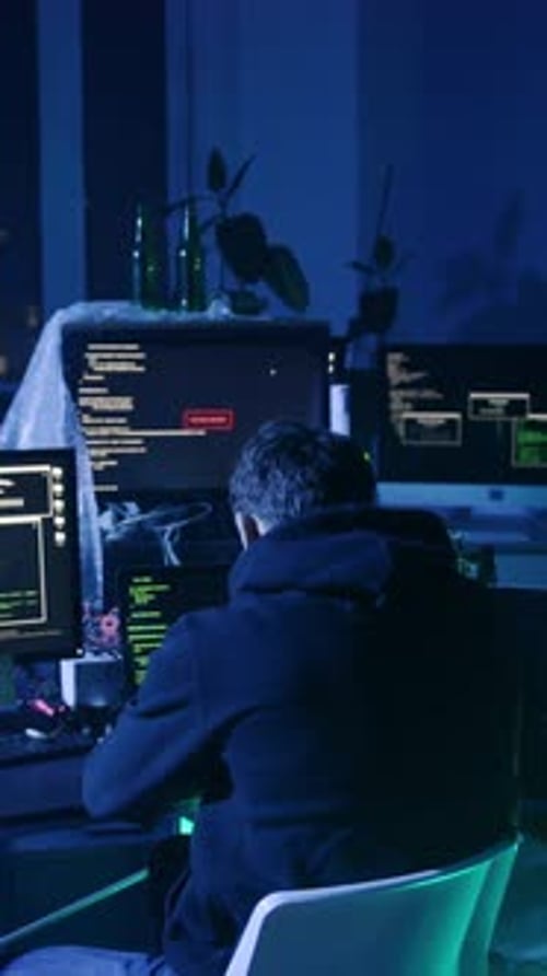 Male Programmer Celebrating Success at Computer