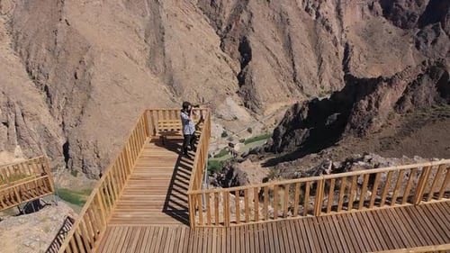 Aerial View Of Man Taking Photo At Observatory On Cliffs