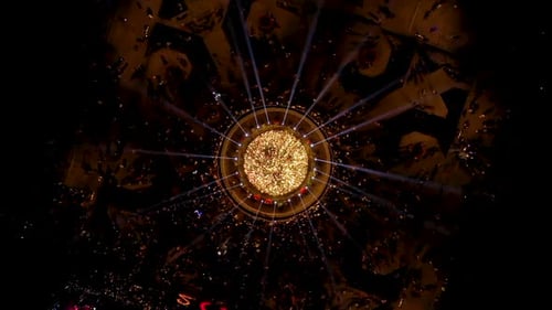 Aerial slow motion view of illuminated lights on a Christmas tree