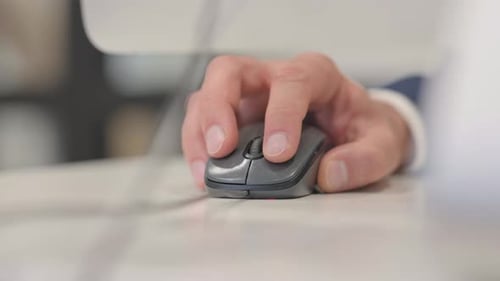Close up of Man Using Computer Mouse for Work