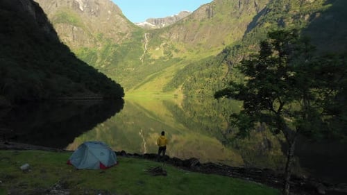a drone shot of camping in naeroyfjord Norway