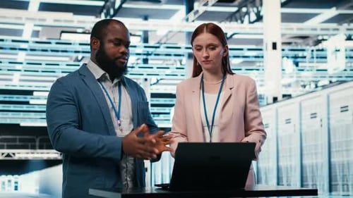 Data Center Coworkers Collaborating to Manage Cloud Computing IT Solutions