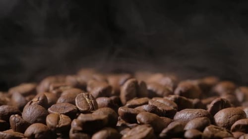 Pile of Steaming, Dark Roasted Coffee Beans