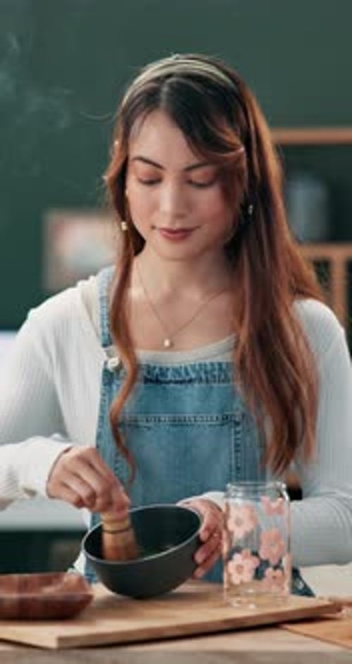 Woman, bowl and making green tea in home for health, wellness and refreshing drink