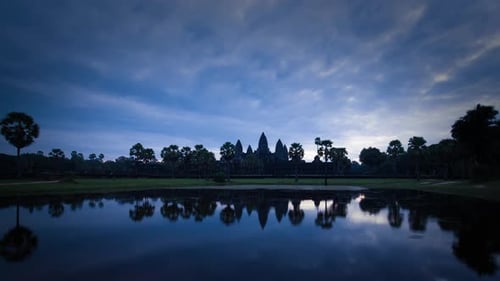 Moody sky over empty Angkor Wat during Covid-19 sunrise and no people.