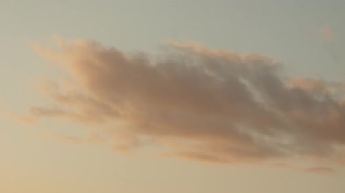 Pastel sunset skies with soft clouds.