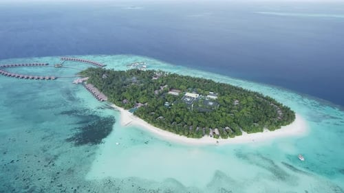 Island with Houses on the Water and a White Beach in the Maldives