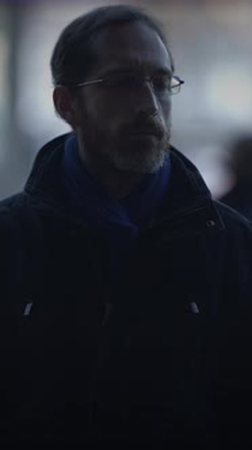 Man with Beard and Glasses Outdoors in City