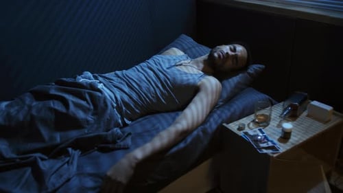 Man Lying in Bed at Night, Sleepless