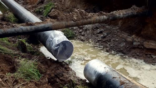 Process of Gas Pipe Laying in Trench Building Gas Supply System Repair Works on Construction Site