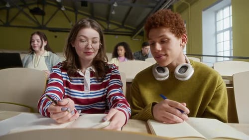 Students Collaborate Taking Notes in Lecture Hall