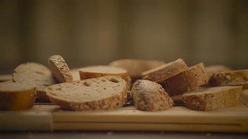 Sliced Seeded Bread on a Wooden Board