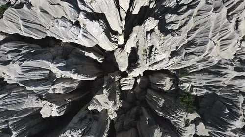 Rugged Grey Rock Formations Creating Dramatic Stone Forest Landscape From Overhead Aerial